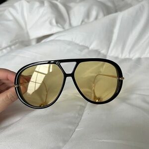 Bottega Veneta Black Frame Sunglasses with Yellow Lenses